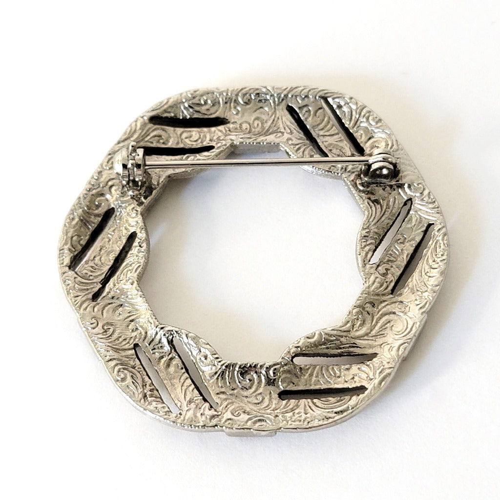 Swirl pattern on back of a brooch.