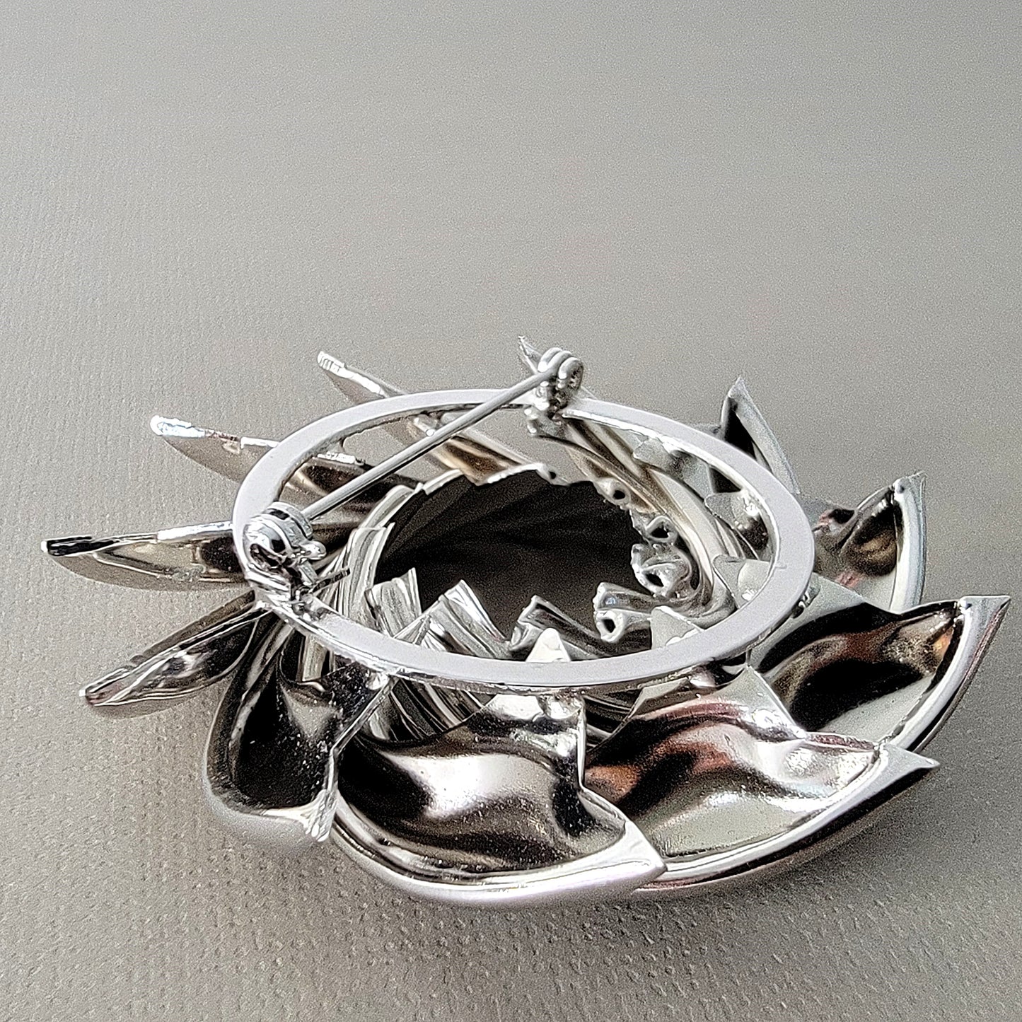 Clasp on the back of a brooch.