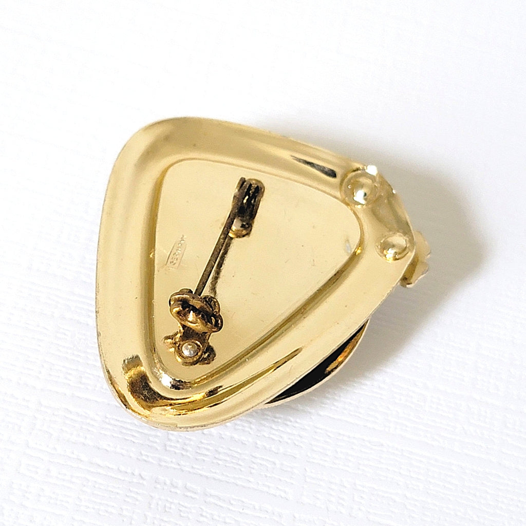 Back of a gold tone vintage pin.