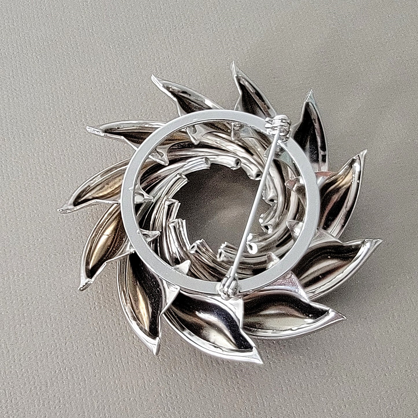 Pin stem and clasp on a brooch.