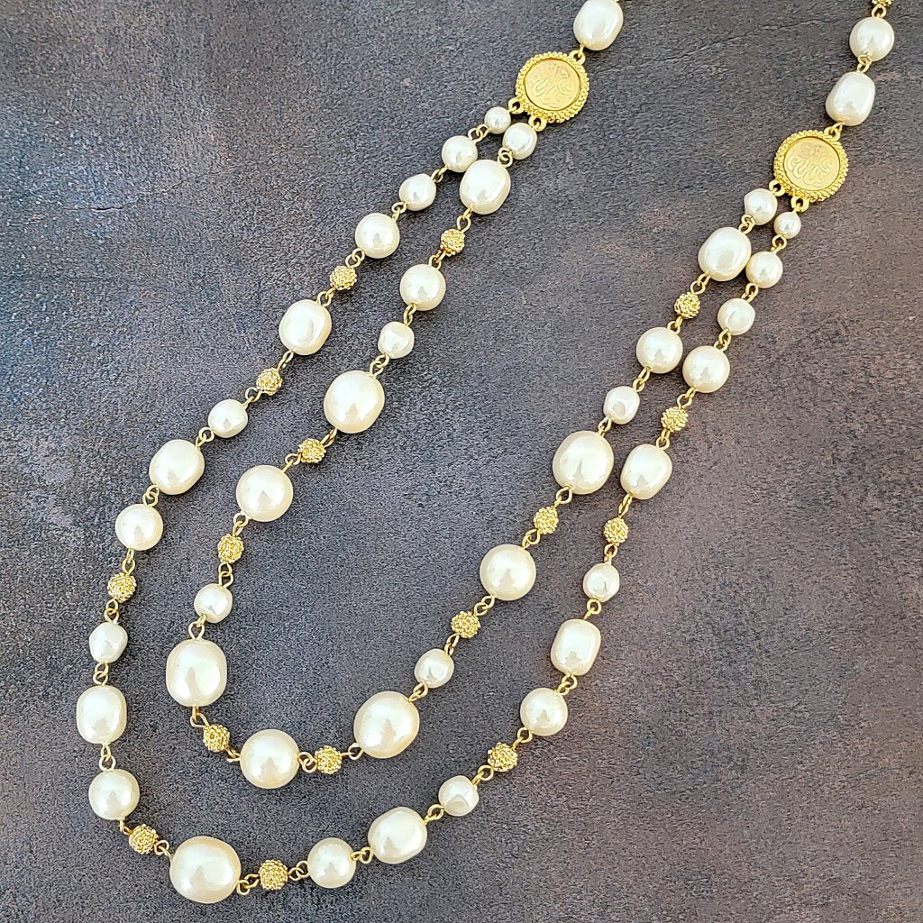 Faux pearl and gold tone bead strands.