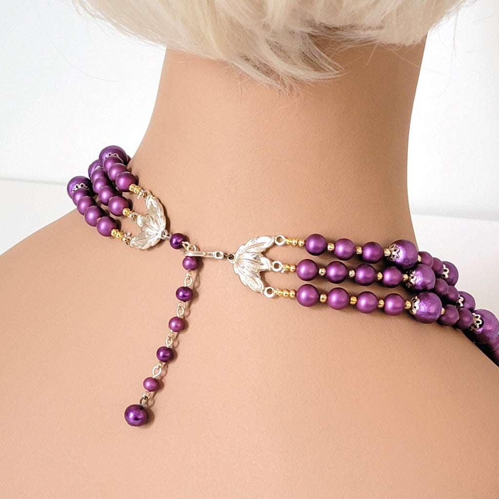 Necklace clasp, back view on a mannequin.