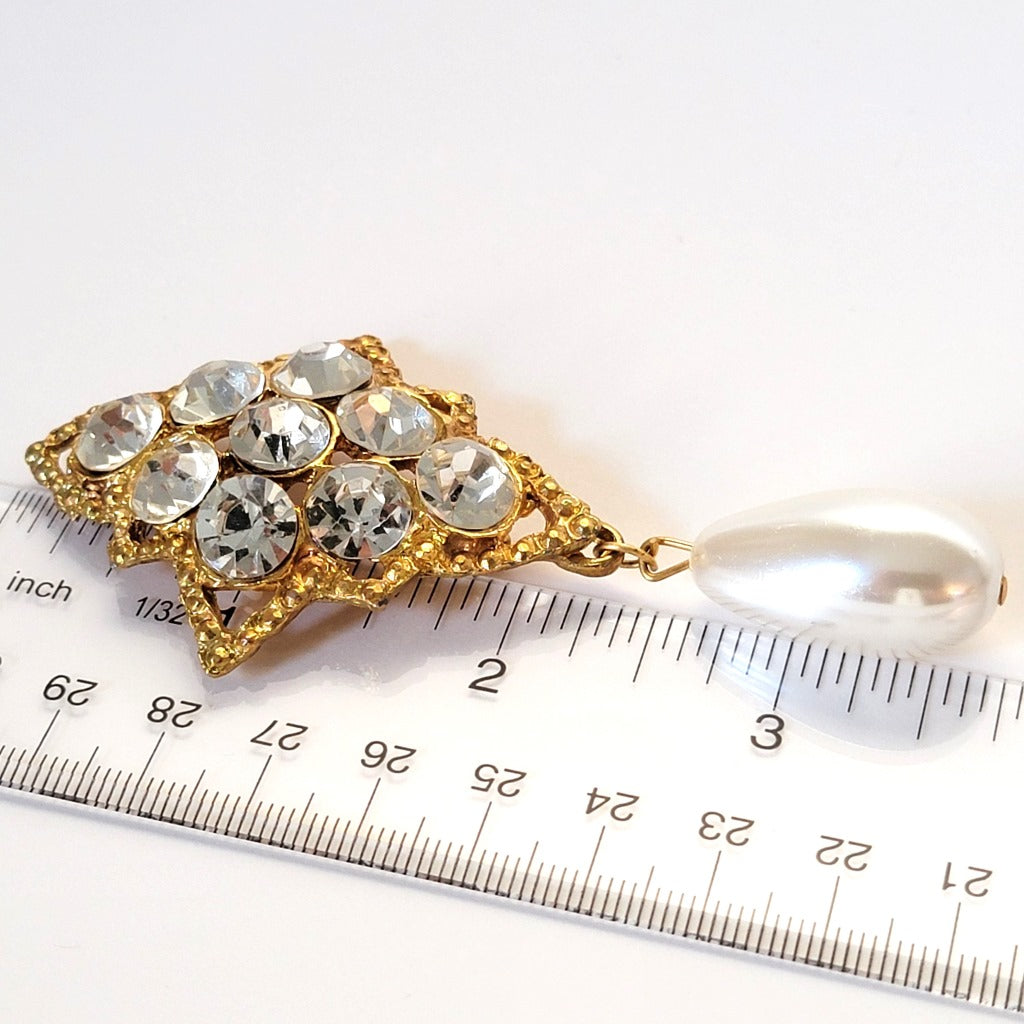 Rhinestone pin with ruler.