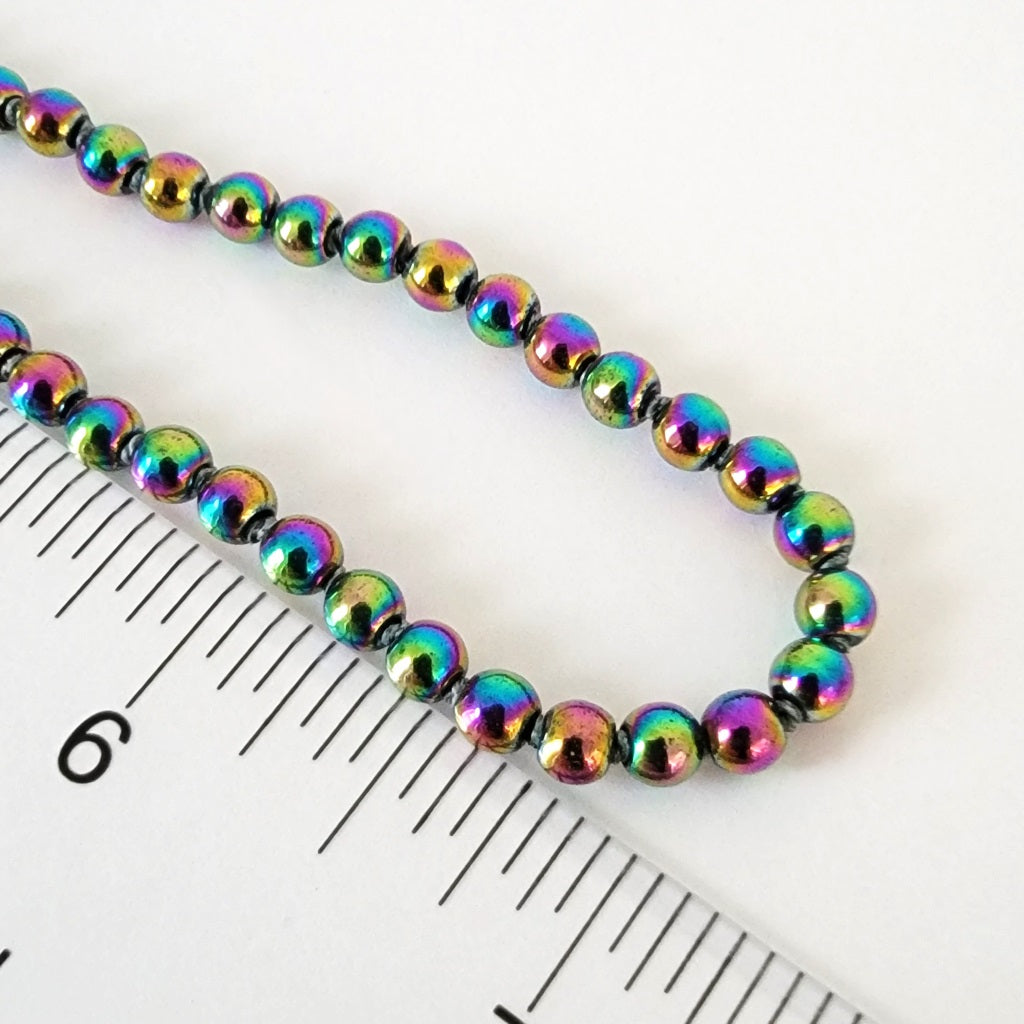 Rainbow beads with ruler.