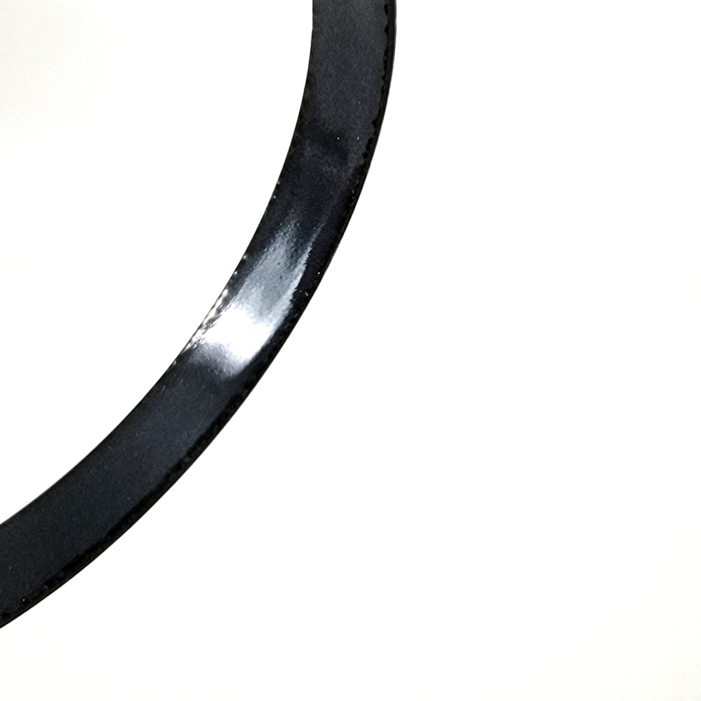 Black enamel inside bracelet.