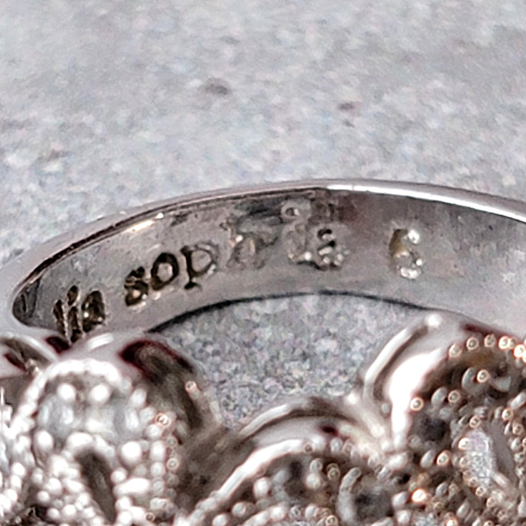 Lia Sophia signature mark inside a ring.