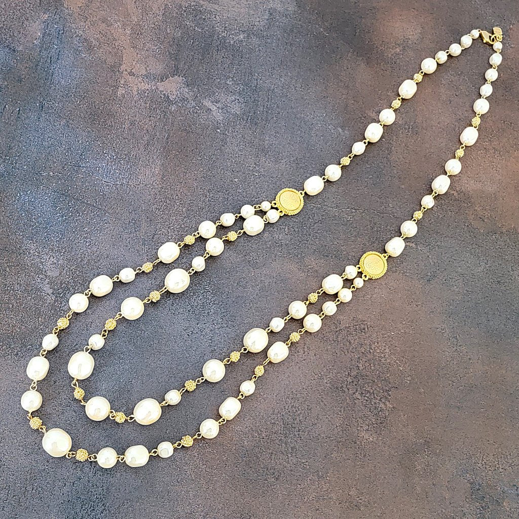 Long two strand faux pearl necklace.