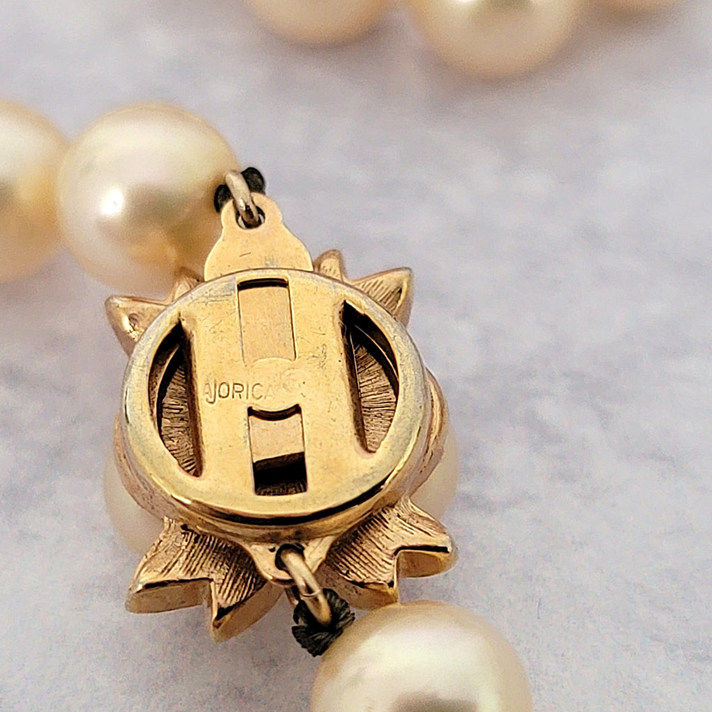 Majorica stamp on a vintage necklace clasp.