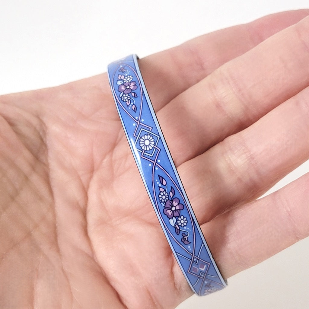 Michaela Frey blue bracelet in hand.