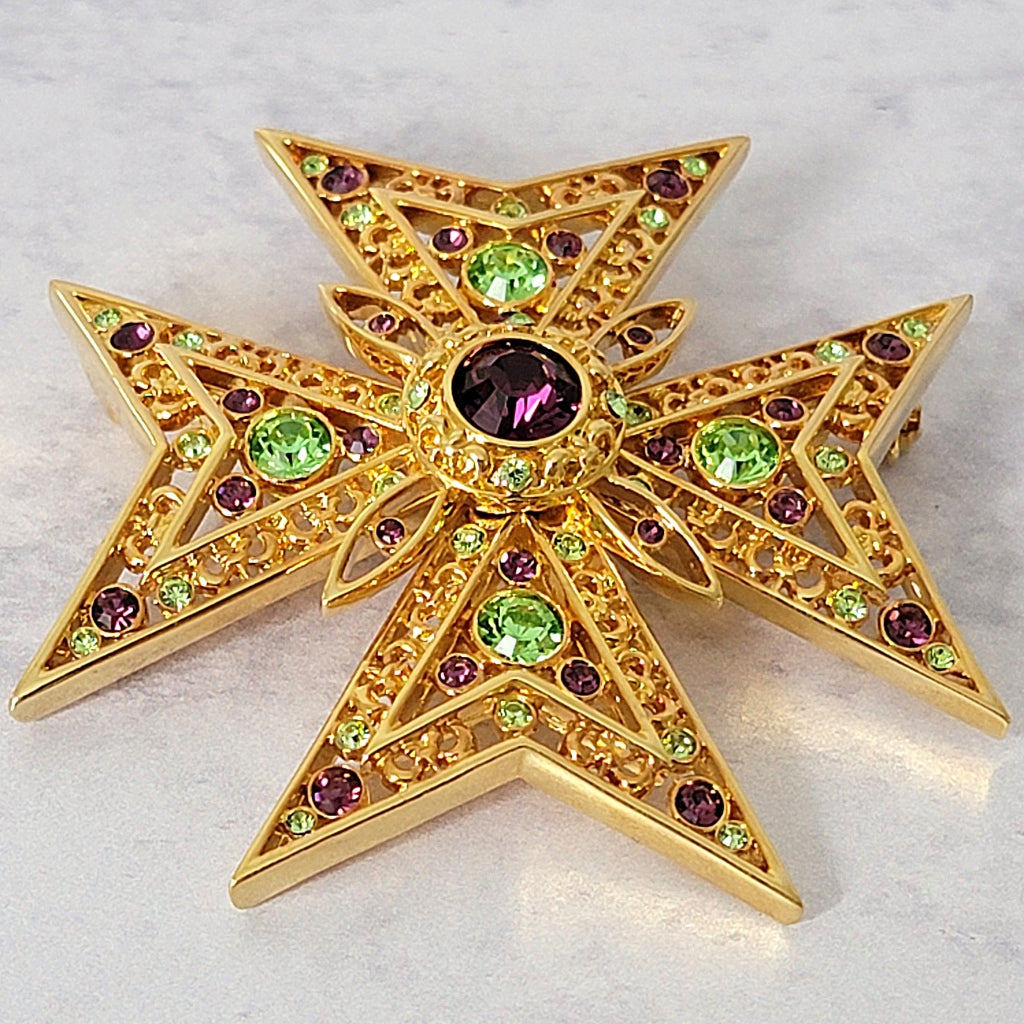 Large crystal Maltese cross brooch.