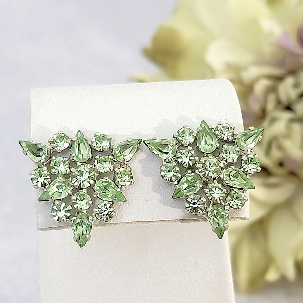 Vintage light green clip earrings in a triangular setting.