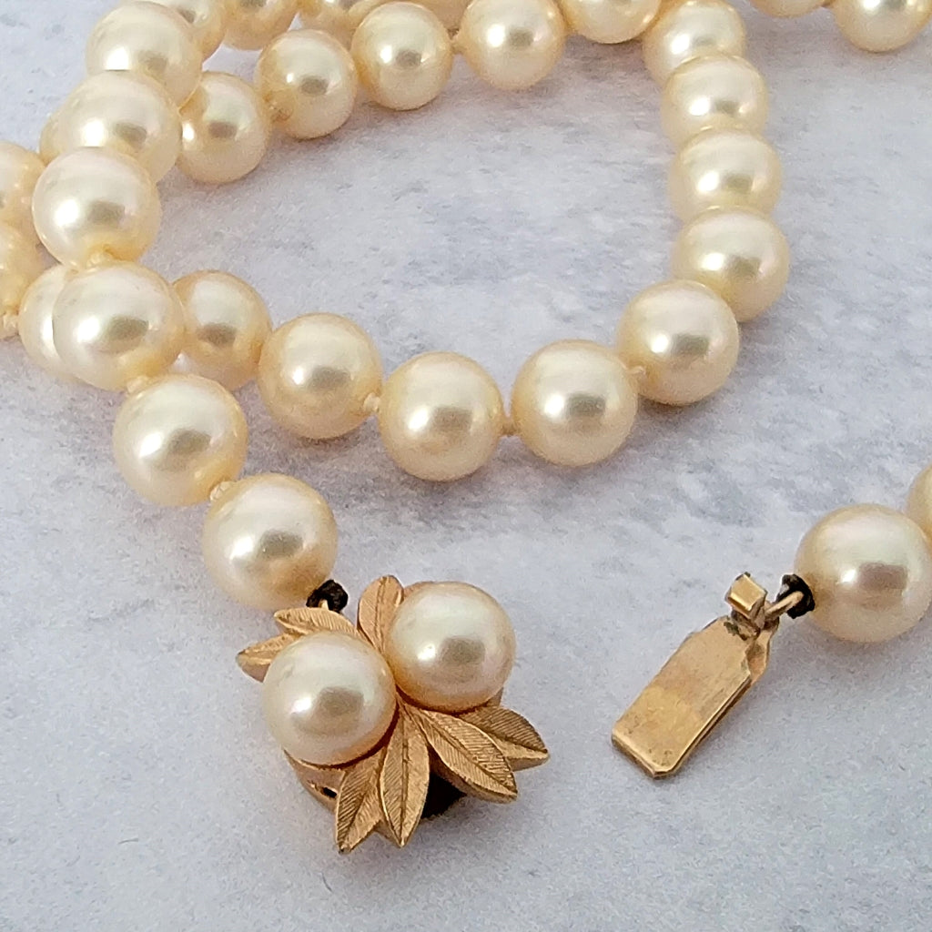 Vintage box clasp on a faux pearl choker.