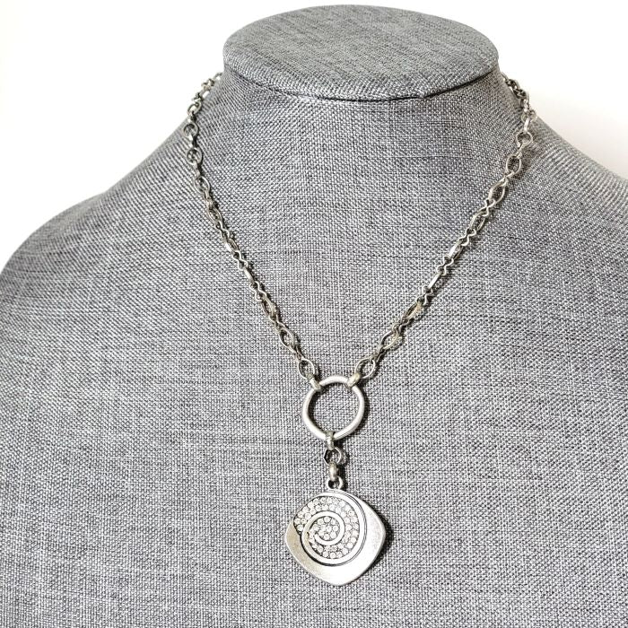 Premier Designs spiral pendant choker, shown on a display stand.