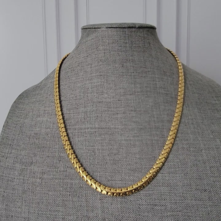 Gold tone thick chain necklace.