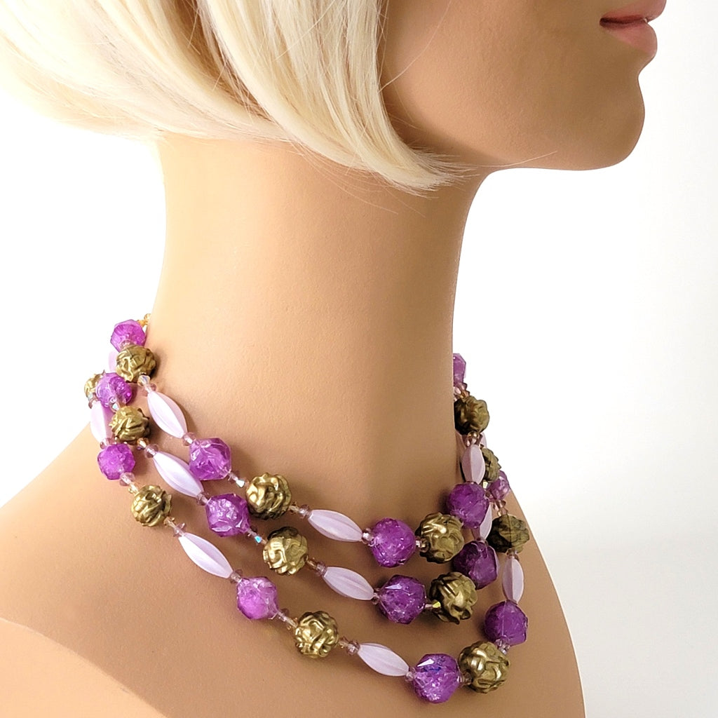 Vintage purple necklace on mannequin.