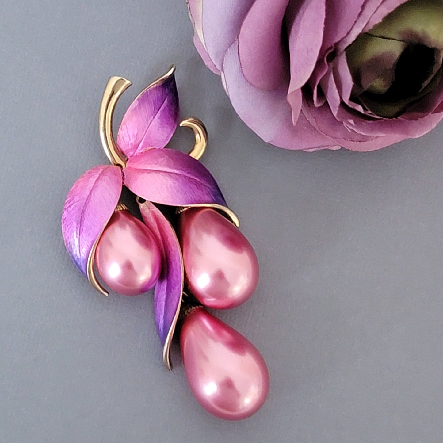 Big pink and purple faux pearl brooch.