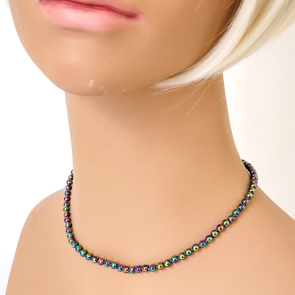 Rainbow choker on mannequin.