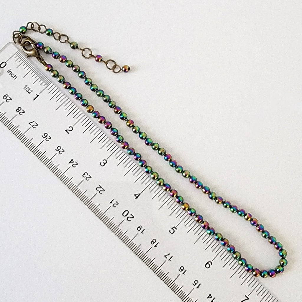 Rainbow necklace with ruler.