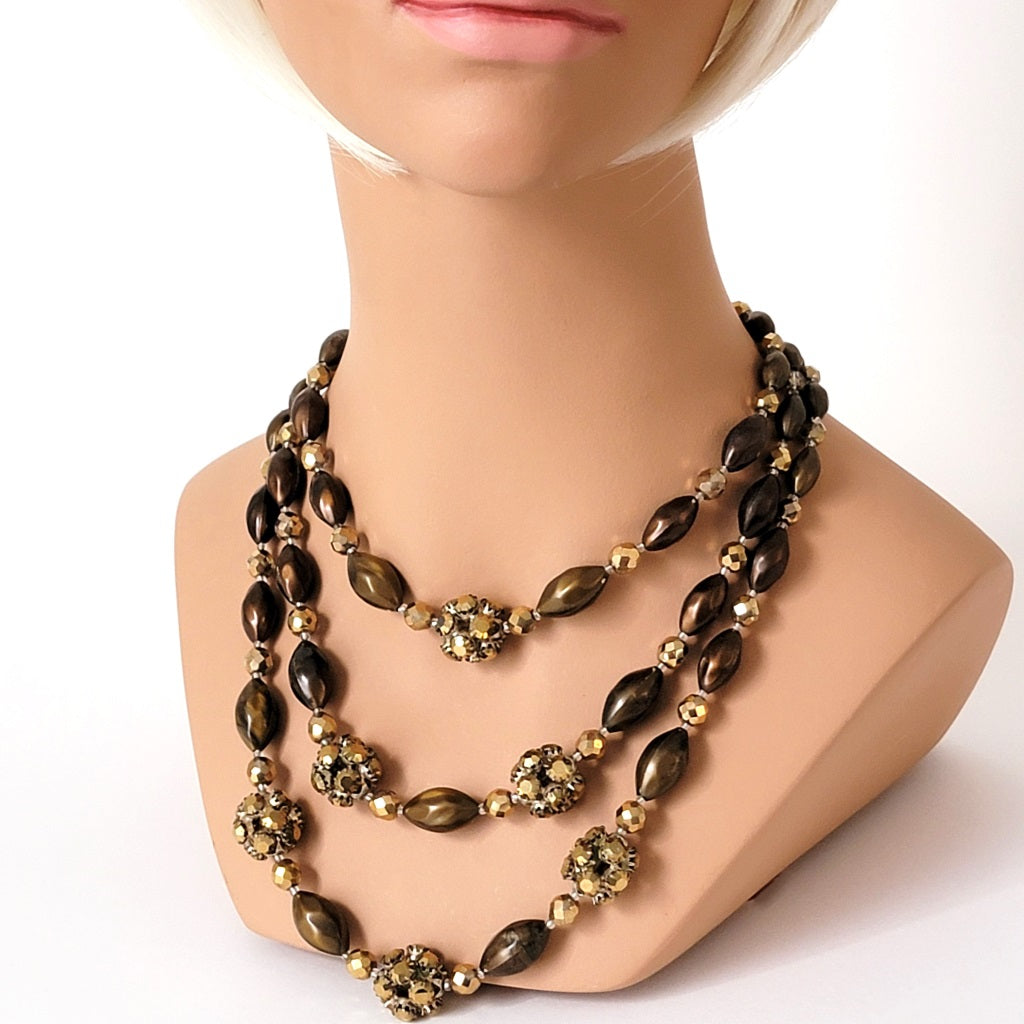 Three strand necklace on mannequin.