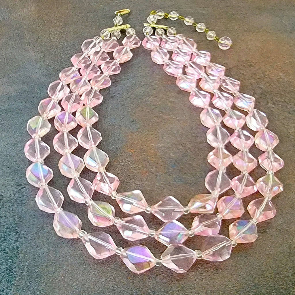 Three strand pink lucite plastic choker necklace.