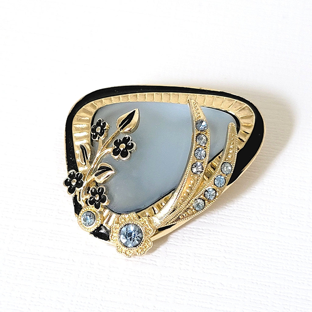 Small vintage floral and blue glass pin from Germany.