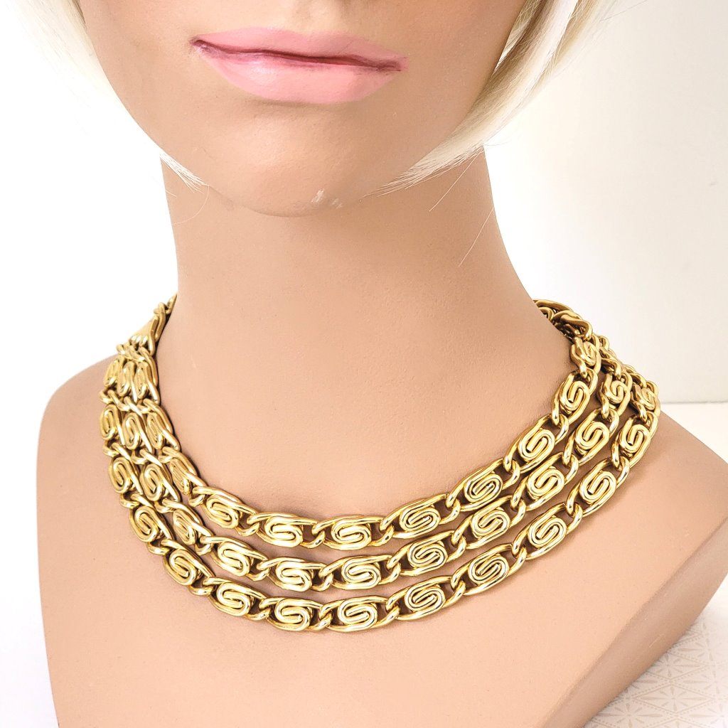 Gold tone Anne Klein three strand snail chain choker, shown on mannequin.
