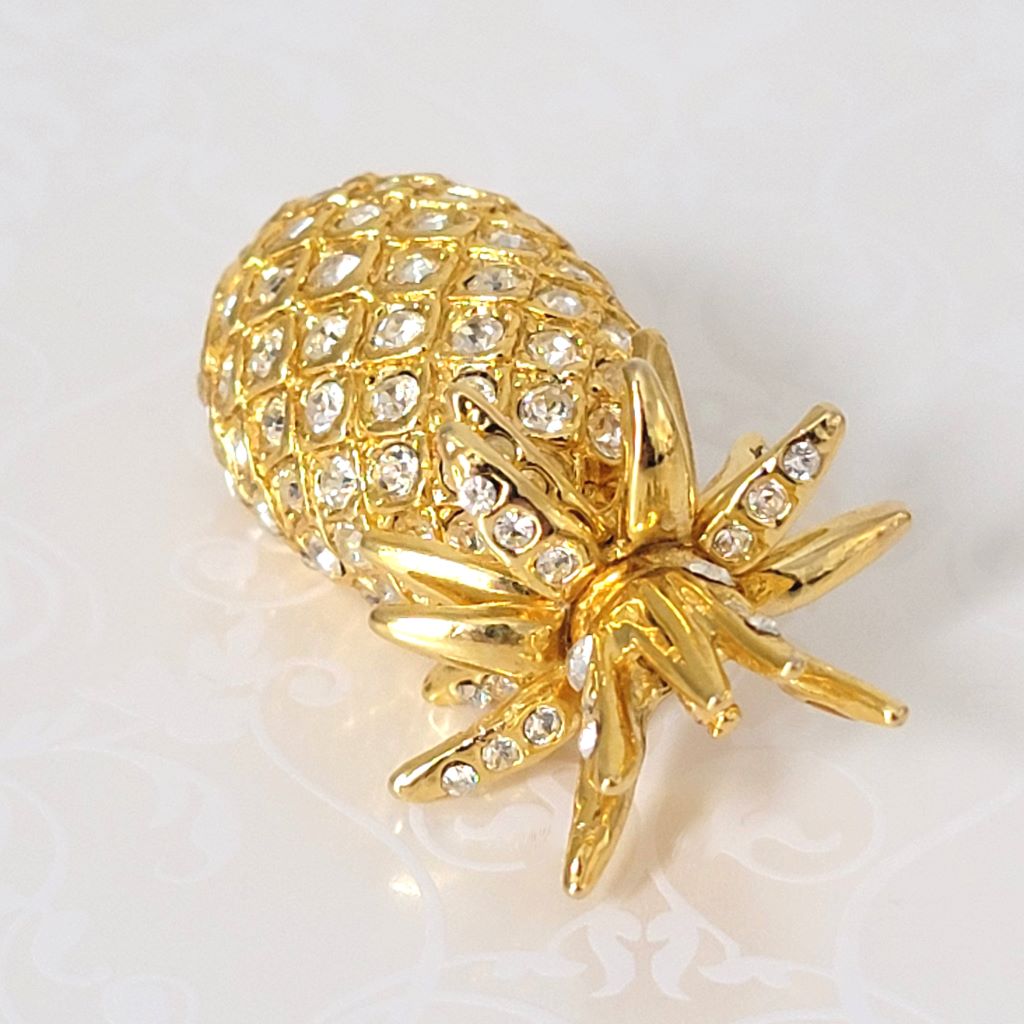 Top view of rhinestone pineapple brooch.
