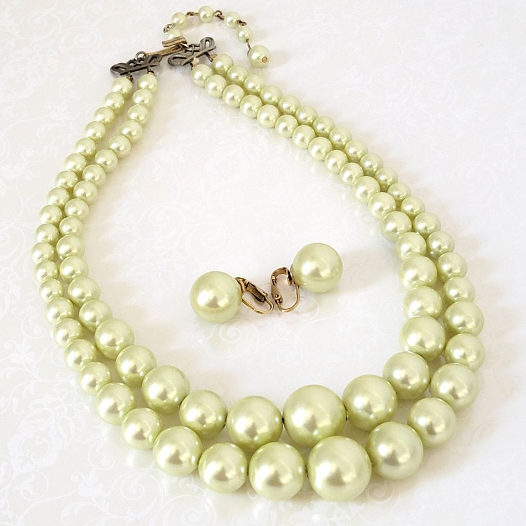 Vintage two strand light yellow faux pearl choker necklace and matching clip on earrings.