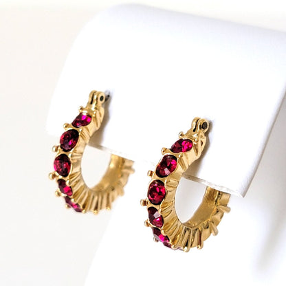 Napier red crystal rhinestone hoop earrings, in gold tone.