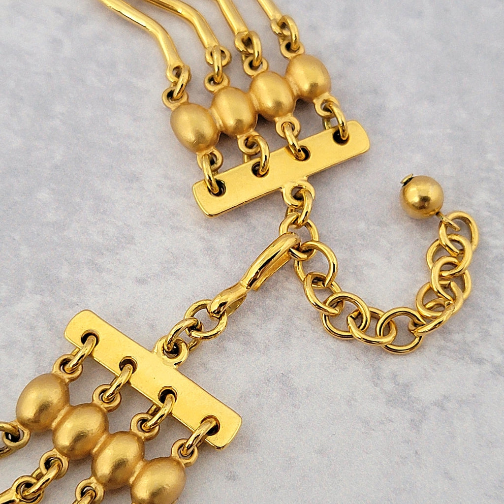 Gold tone necklace hook style clasp and extender chain.