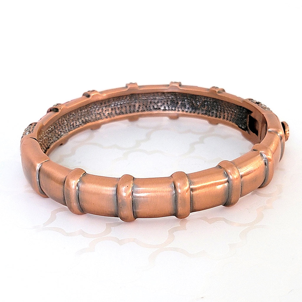 Copper tone bracelet.