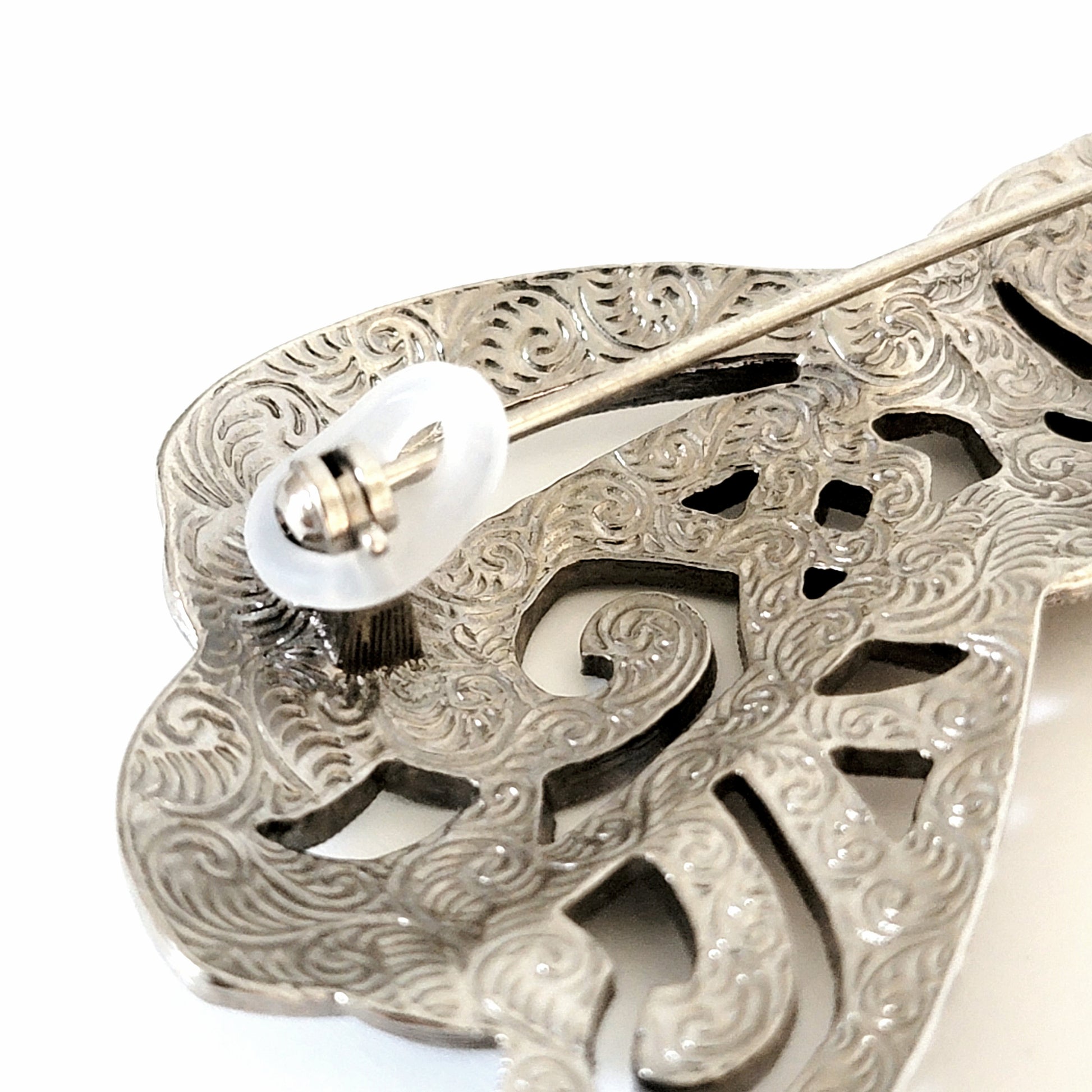 Back of brooch with silicone lock.