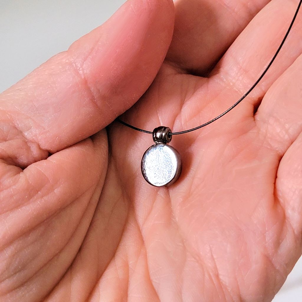 Back view of the pendant on a vintage choker necklace.