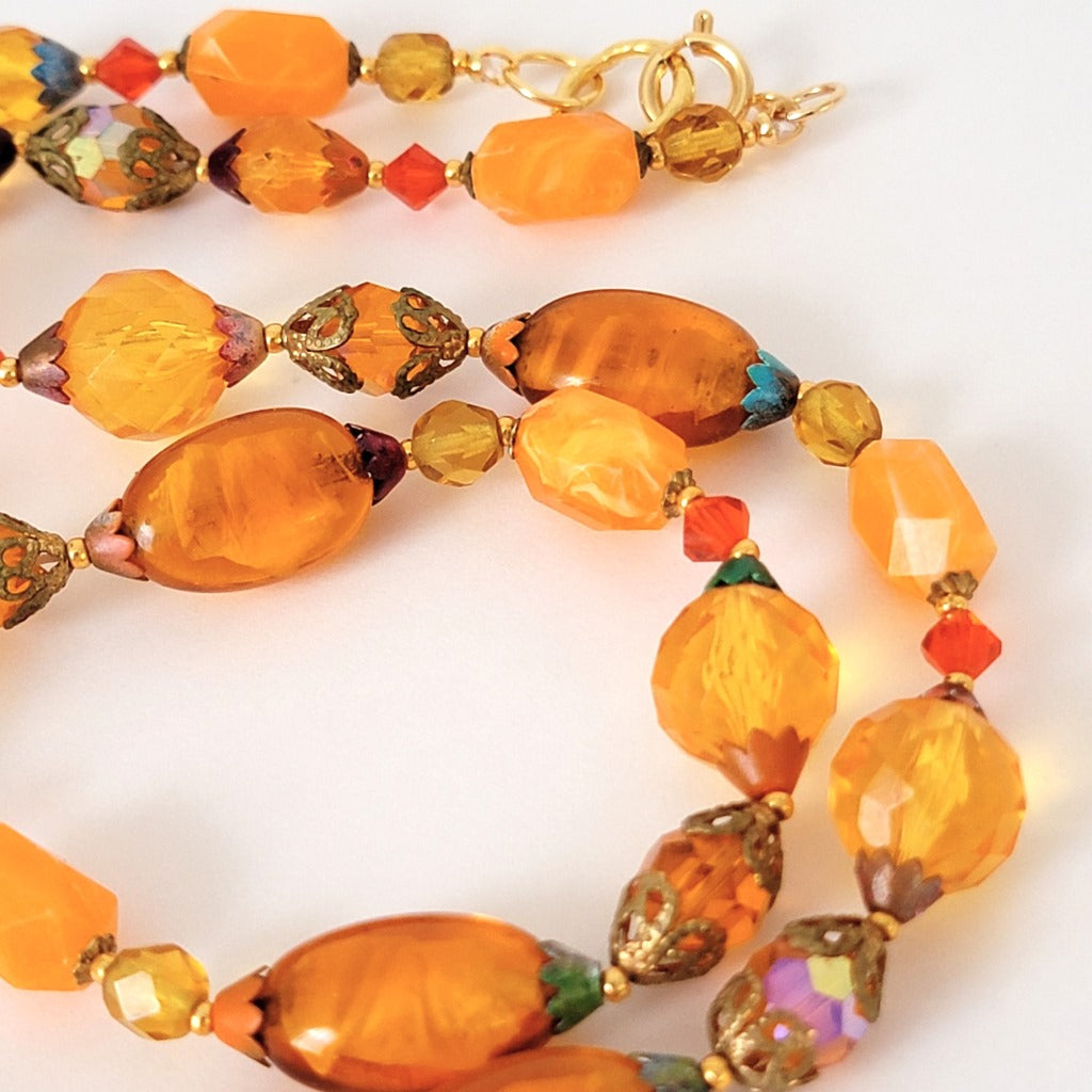 Orange glass and lucite beads.