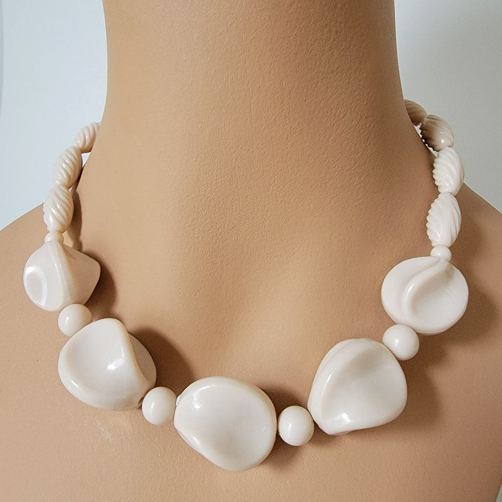 Chunky choker on mannequin.