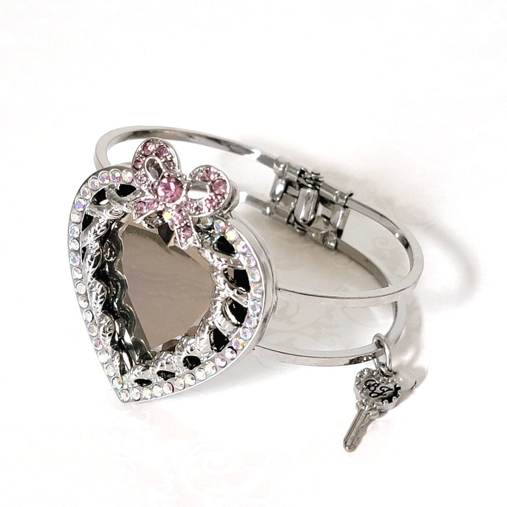 Betsey Johnson rhinestone mirror heart bracelet, with pink bow, and key signature tag.
