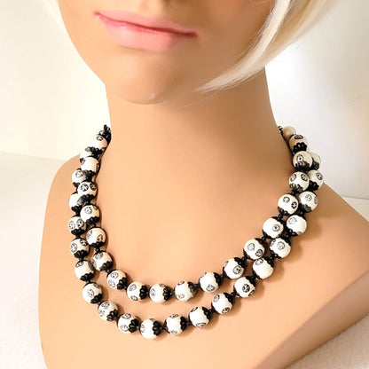 Black and white necklace on mannequin.