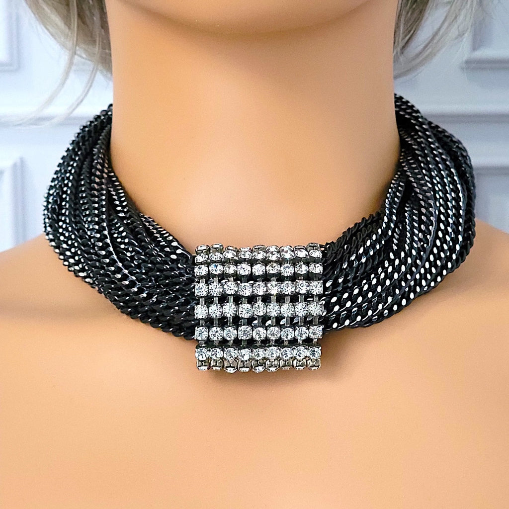 Black aluminum chain necklace on a mannequin.