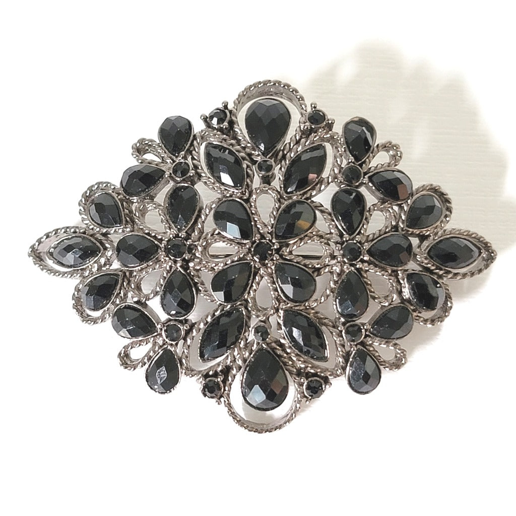 Monet black rhinestone brooch.