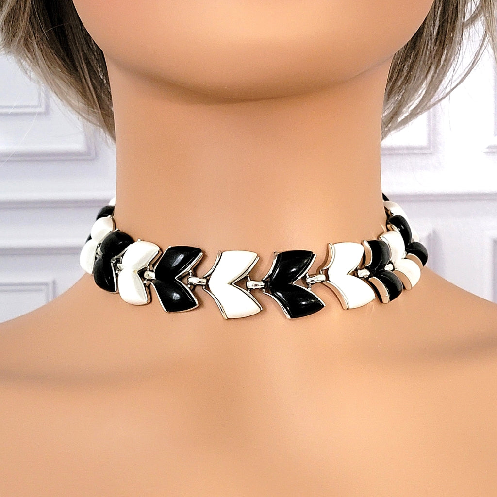 Black and white midcentury choker on a mannequin.