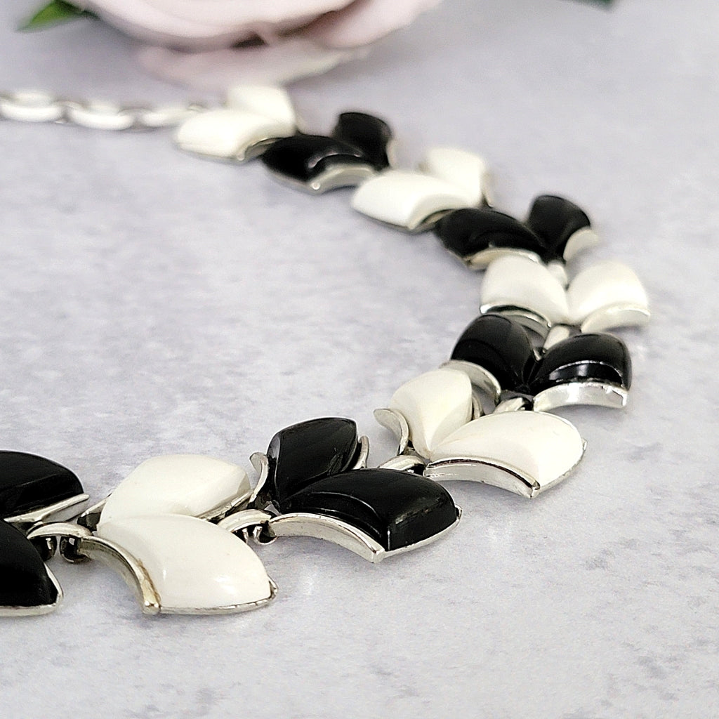 Black and white chevron shaped thermoset plastic necklace links.