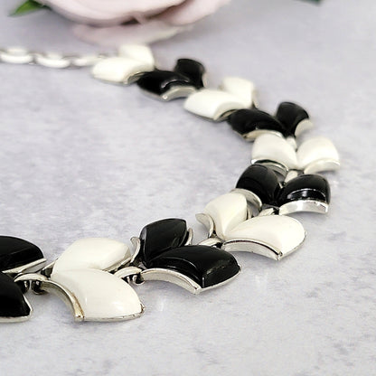 Black and white chevron shaped thermoset plastic necklace links.