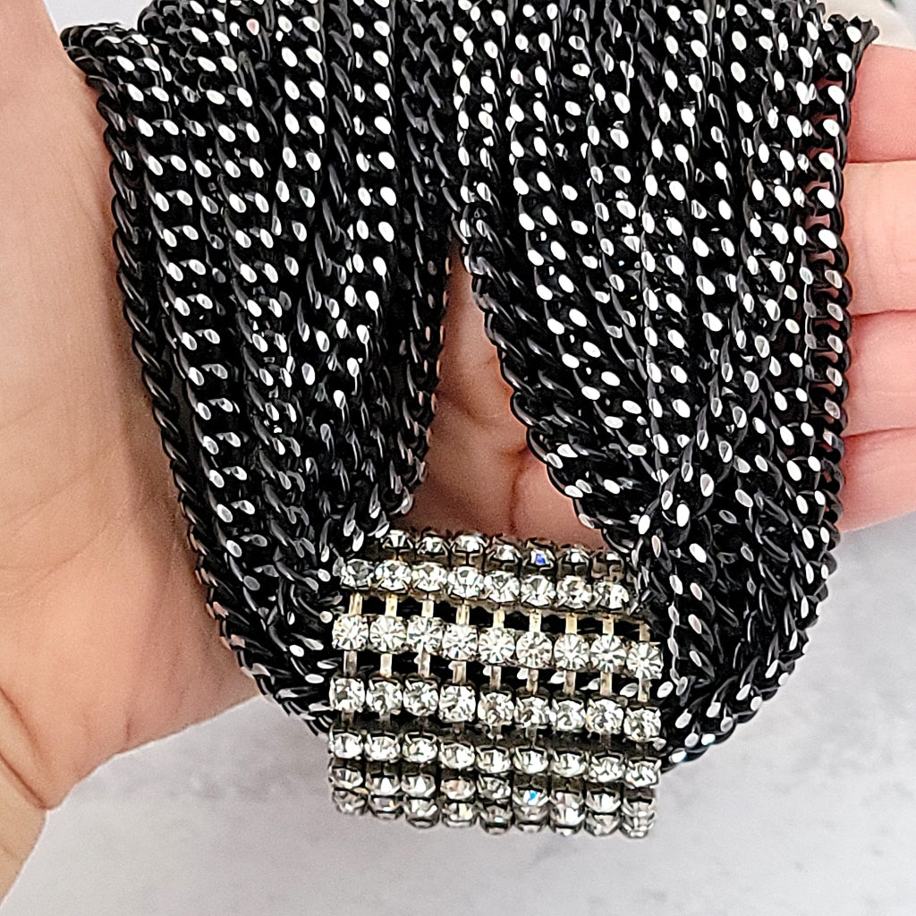 Black aluminum chains with a rhinestone focal enhancer.