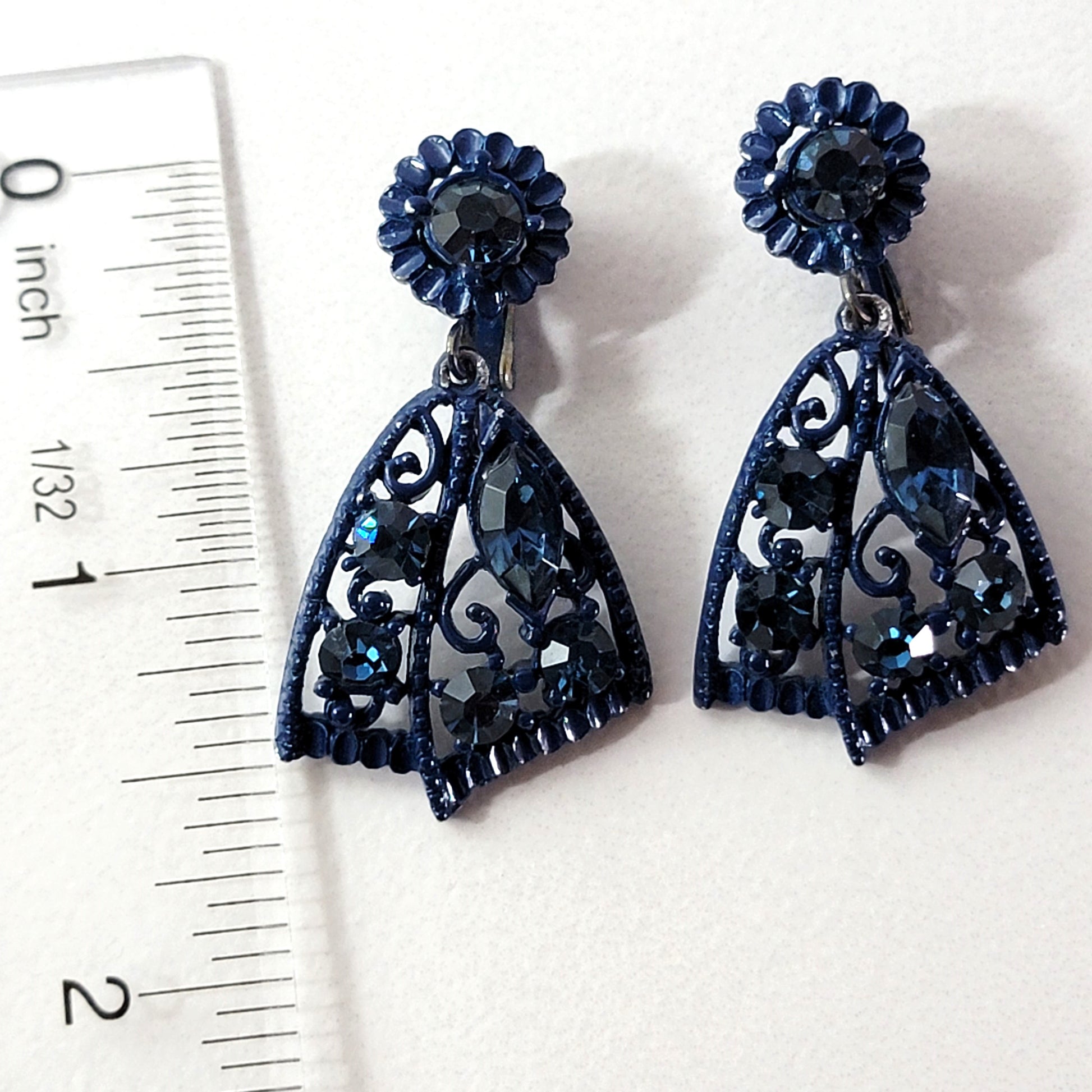 Blue rhinestone dangle earrings with ruler.