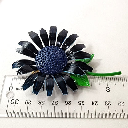 Flower brooch with ruler.
