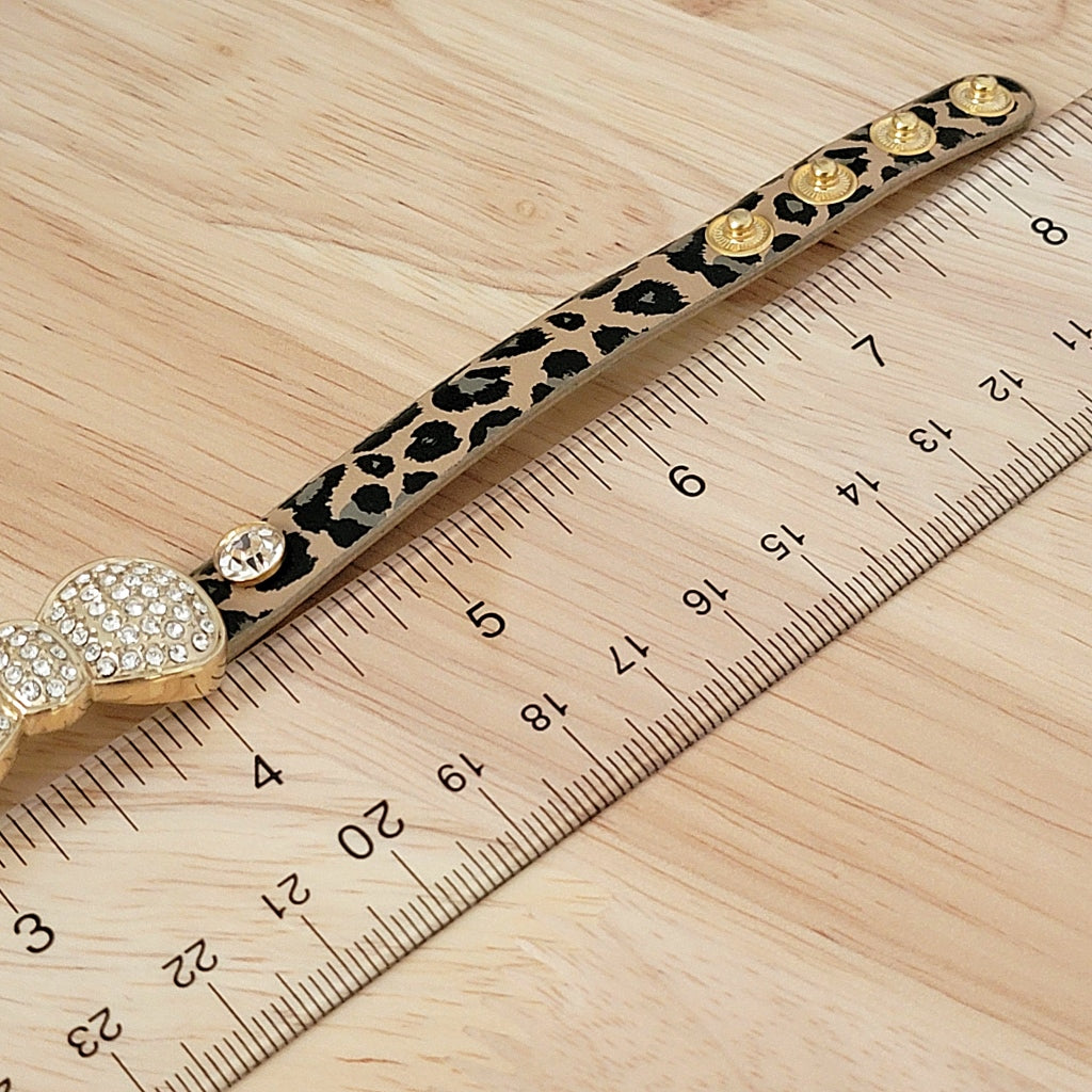 Bracelet band next to a ruler.