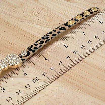 Bracelet band next to a ruler.