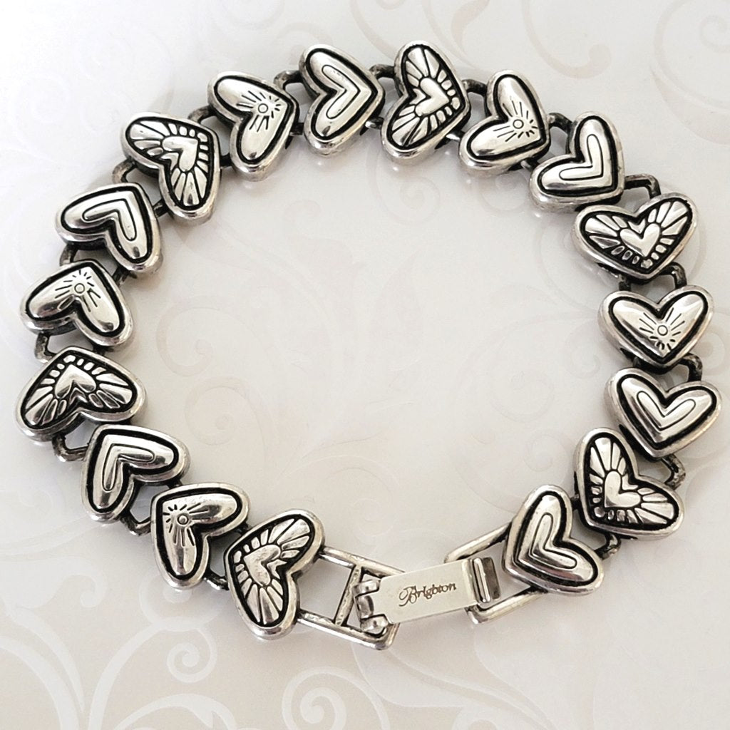 Silver plated hearts bracelet, with black accents, showing Brighton signature mark.