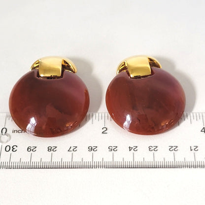 Chunky plastic earrings with ruler.