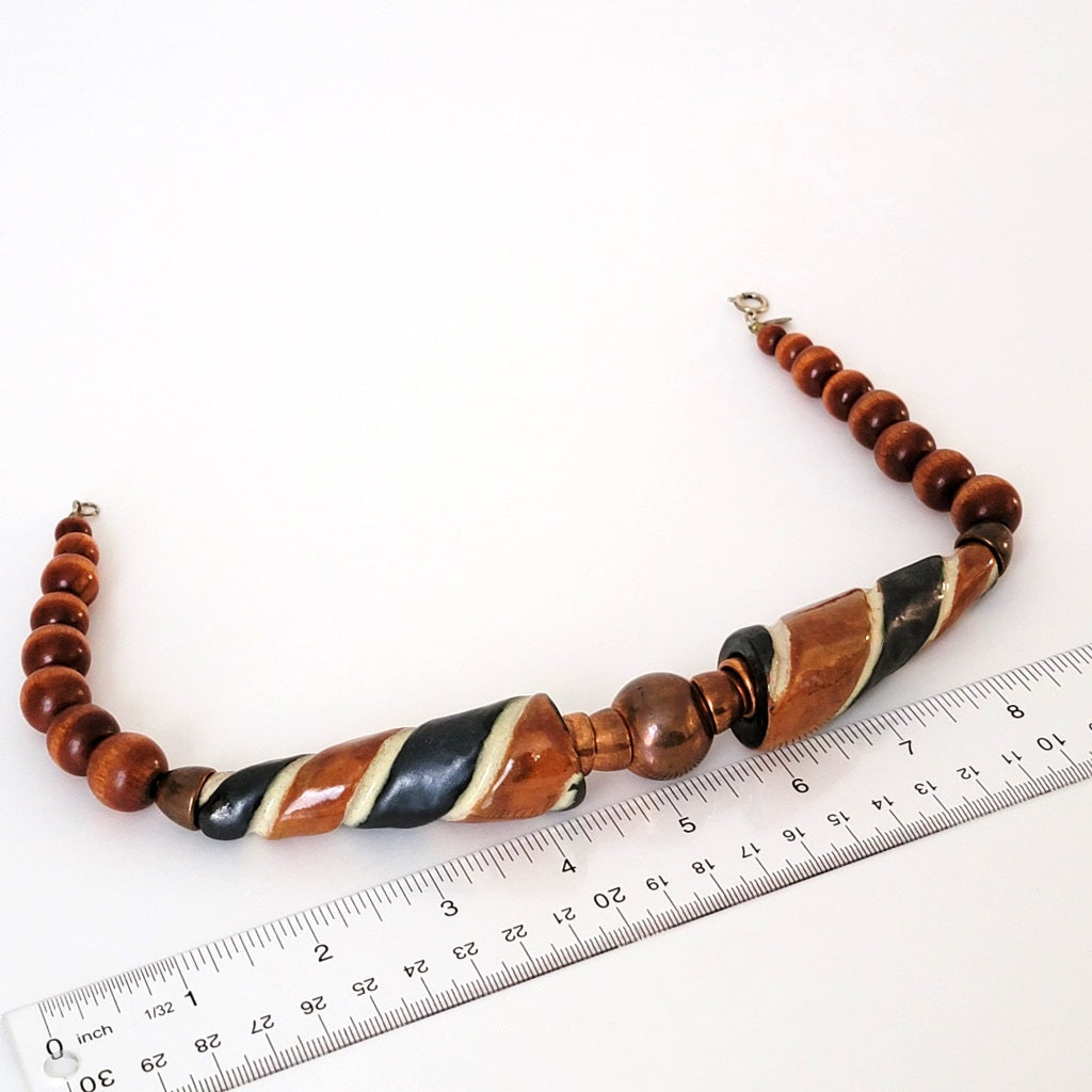 Chunky wood and ceramic beaded necklace with ruler.